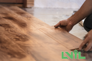 a person installing wooden slabs